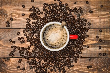 Coffee cup and coffee beans on table. Top view with copy space for your text. espresso hot.の写真素材