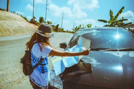 woman travel relaxing nature mountain map navigation. Travel relax in the holiday. View map travel...