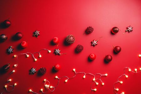 Merry Christmas and Happy New Year. background design with ornaments the ball red decorations On a red background with copy space for your text. Led lightsの写真素材