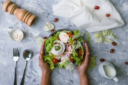 Concept for a tasty and healthy vegetarian meal. healthy vegan lunch bowl. Top view Greek salad on stone background. vegetable organic Salad.の写真素材