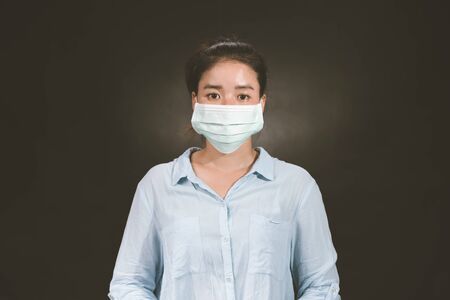 Asian woman wearing protection face mask against coronavirus. antiviral medical mask for protection...