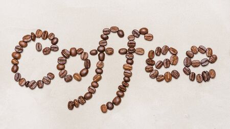 the word coffee is made of coffee beans.On a white background. copy space word  coffeeの写真素材