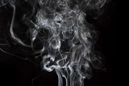 Smoke isolated on black background. Movement of white smokeの写真素材