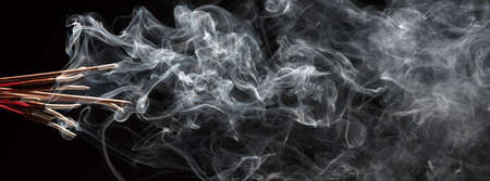 Smoke isolated on black background. Movement of white smoke
