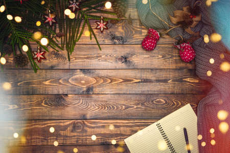 The girl is using the hand to hold the ball red decorations On a red background with christmas ornaments with led light. Top view. Christmas family traditions. Concept christmas.の写真素材