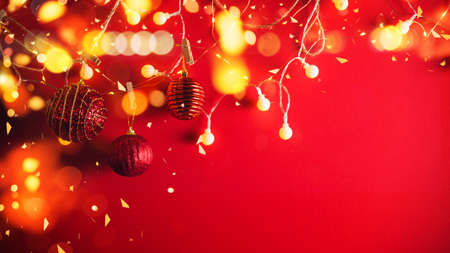 Christmas decoration balls and ornaments over abstract bokeh background with copy space. Holiday background greeting card for Christmas and New Year. Merry Christmasの写真素材