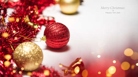 Christmas decoration balls and ornaments over abstract bokeh background on white background. Holiday...