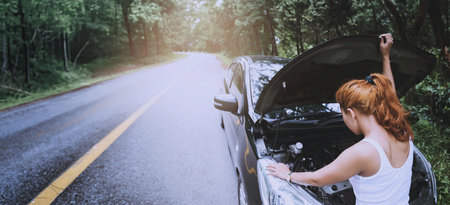 Women The car was broken on the highway. countryside. Women broken carの写真素材