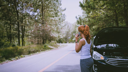Women The car was broken on the highway. countryside. Women broken carの写真素材