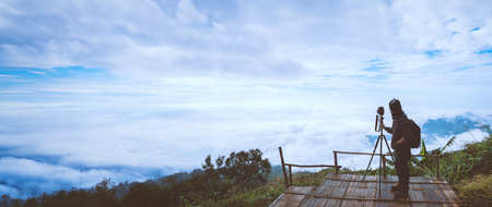 man asians travel relax in the holiday. Photograph landscape on the Moutain.Thailand