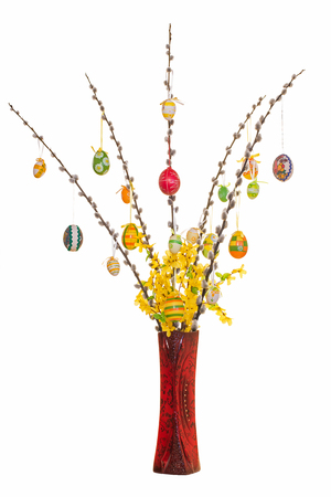 Egg tree with vase for Easter isolated against white backgroundの写真素材