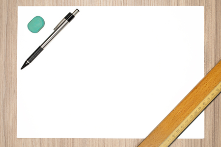 Blank paper with pencil, ruler and rubber on wood deskの写真素材