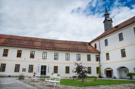 Courtyard of the Skofja Loka Castle with tower in Sloveniaのeditorial素材