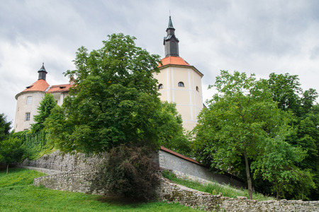 Front of the Skofja Loka Castle with statue in Sloveniaのeditorial素材