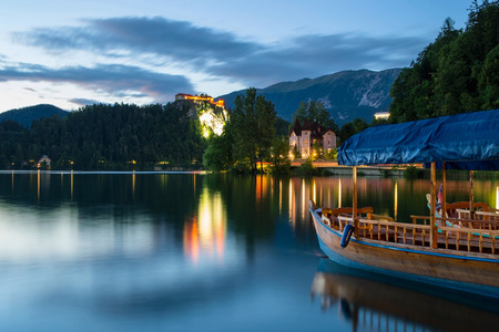 Pletna on Lake Bled at dusk in Sloveniaのeditorial素材