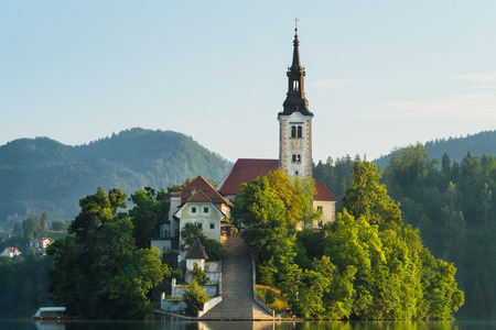 Bled island closeup and pletna on Lake Bled in Sloveniaの写真素材