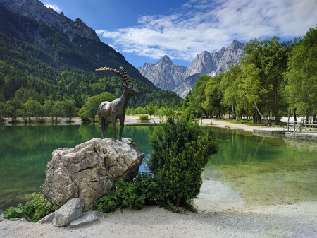 Lake Jasna and mountain goat statue in Kranjska Gora in Sloveniaの写真素材