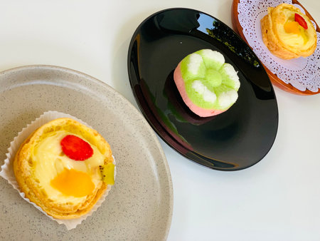 Delicious pastries in a white plate on a white background.