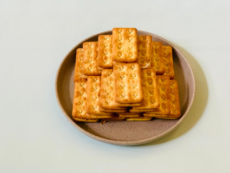 Biscuits in a plate on a white background. Selective focus.