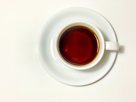 Cup of tea on a white background, closeup of photoの写真素材