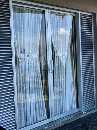 Window with blinds and blue sky. Tuscany, Italyの写真素材