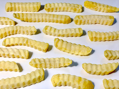 French fries on a white background, close-up, top view