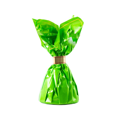 Candy in green wrapper - isolated on white backgroundの写真素材