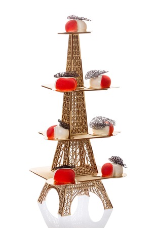 Group of french mousse cakes in form of heart, covered with red and white glaze.の写真素材