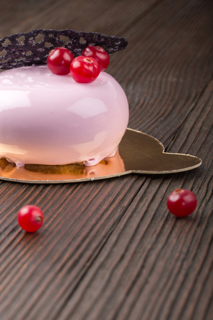 French mousse cake covered with pink glazeの写真素材