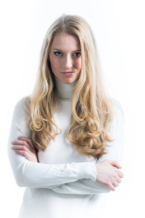 Beautiful Russian blonde girl on a white background in a turtleneckの写真素材