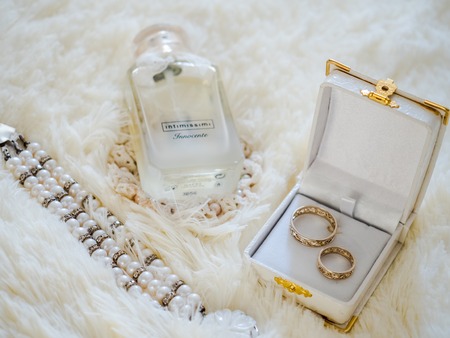 wedding rings, perfume and braceletの写真素材
