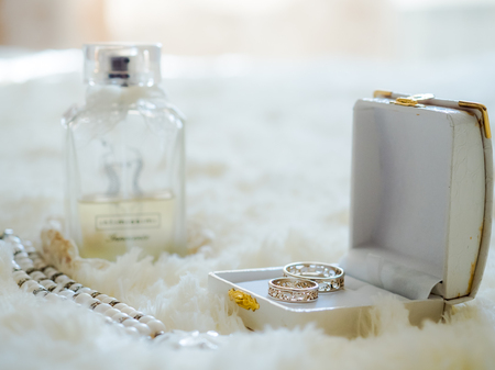 wedding rings, perfume and braceletの写真素材