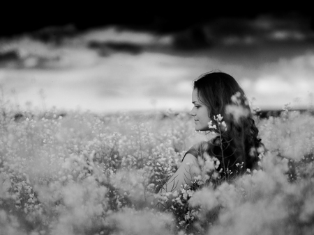beautiful russian girl in a canola field