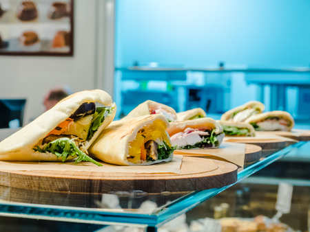 sandwich with pepper, tomatoes and greensの写真素材