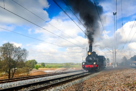 the Soviet locomotive rushes along the ways in the morning