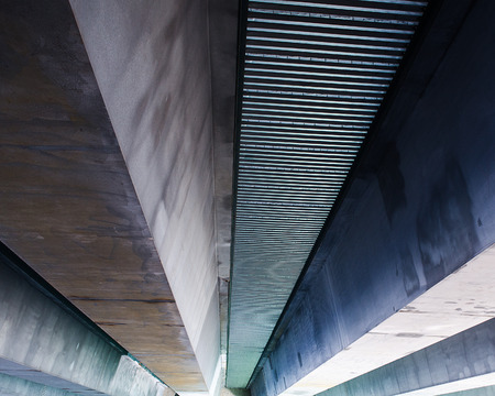 Underside of a four lane highway bridgeの写真素材