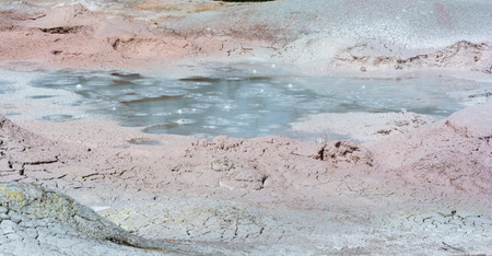 A mud pool bubbles from the heat of Yellowstone geothermal system.