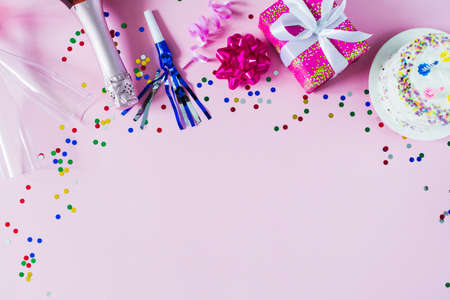 happy birthday day background with gift and confetti and place for text.
