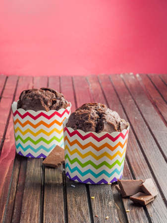 Happy Birthday day cupcake and cake bakery with candles, bright lights bokeh. Background holiday...