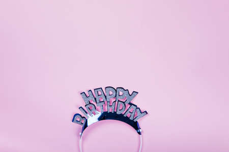 Happy Birthday day cupcake and cake bakery with candles, bright lights bokeh. Background holiday with confetti, balloon and place for text.の写真素材