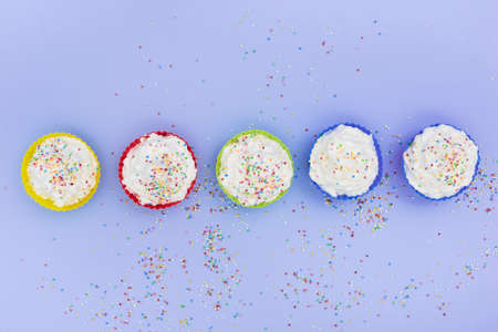 Holiday cupcake background with place for text. Top view. Happy birthday concept.