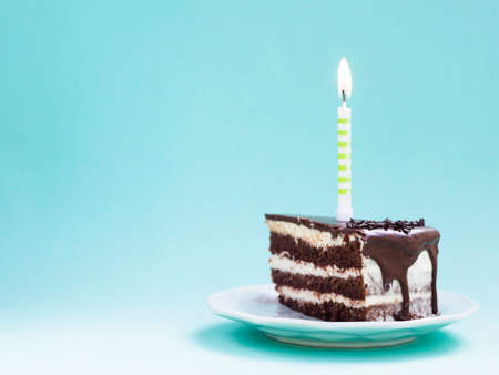 Happy birthday day cake or cupcake with candles and light. Background with place for text.