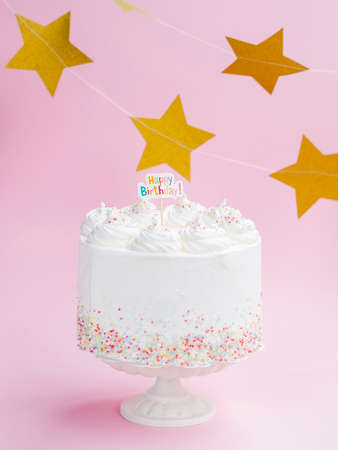 Happy birthday day cake or cupcake with candles and light. Background with place for text.