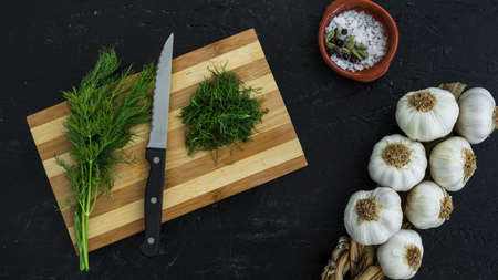 Various herbs spices with place for text isolated dark background, plate. Top view.の写真素材