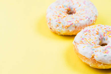 Abstract colorful donuts bakery, sweet concept background with place for text. Top view. Glazed...