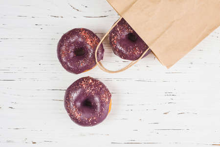 Abstract colorful donuts bakery, sweet concept background with place for text. Top view. Glazed...