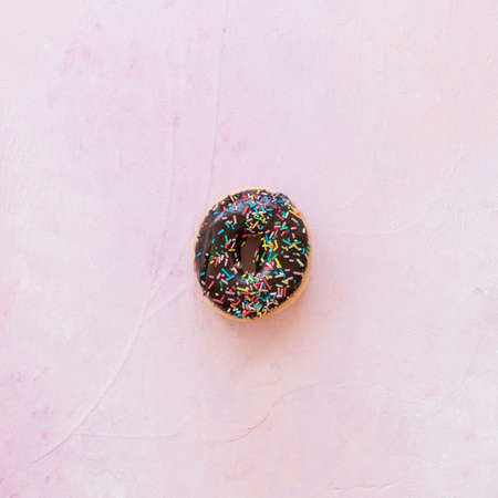 Abstract colorful donuts bakery, sweet concept background with place for text. Top view. Glazed donuts on color background.の写真素材