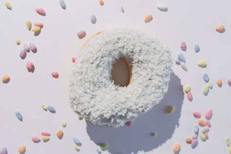 Abstract colorful donuts bakery, sweet concept background with place for text. Top view. Glazed donuts on color background.の写真素材