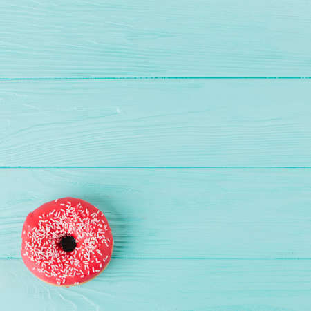 Abstract colorful donuts bakery, sweet concept background with place for text. Top view. Glazed donuts on color background.の写真素材