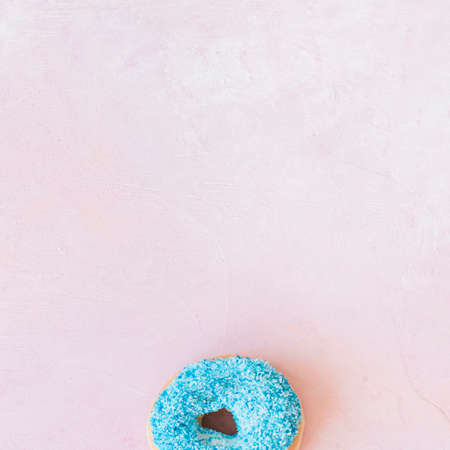 Abstract colorful donuts bakery, sweet concept background with place for text. Top view. Glazed donuts on color background.の写真素材